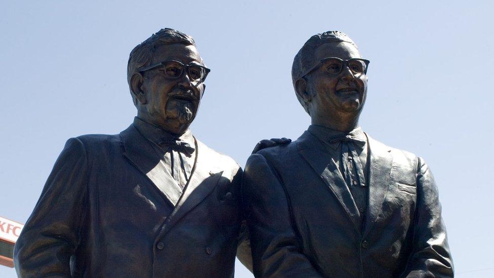 A statue of Colonel Harland Sanders (L) and Pete Harman stands at the newly rebuilt first KFC location on 11 August, 2004 in Salt Lake City, Utah. The world's first KFC location opens back up after the original 52 year-old building was razed. The eating establishment also doubles as a museum of memorabilia.