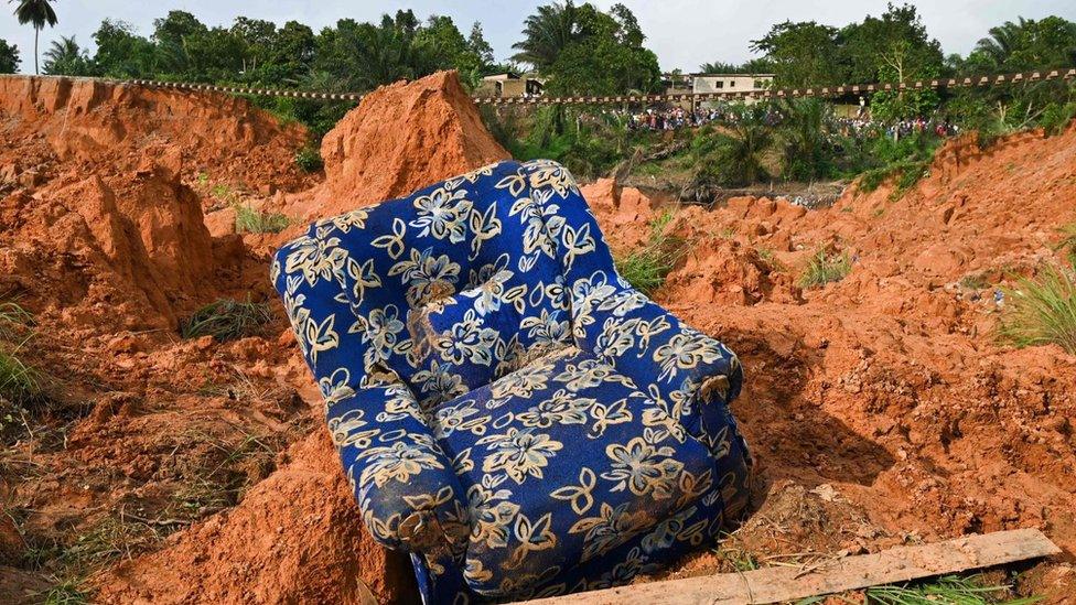 An armchair among rubbles at the site of a landslide that killed 13 people the day before, in Anyama, near Abidjan - 19 June 2020