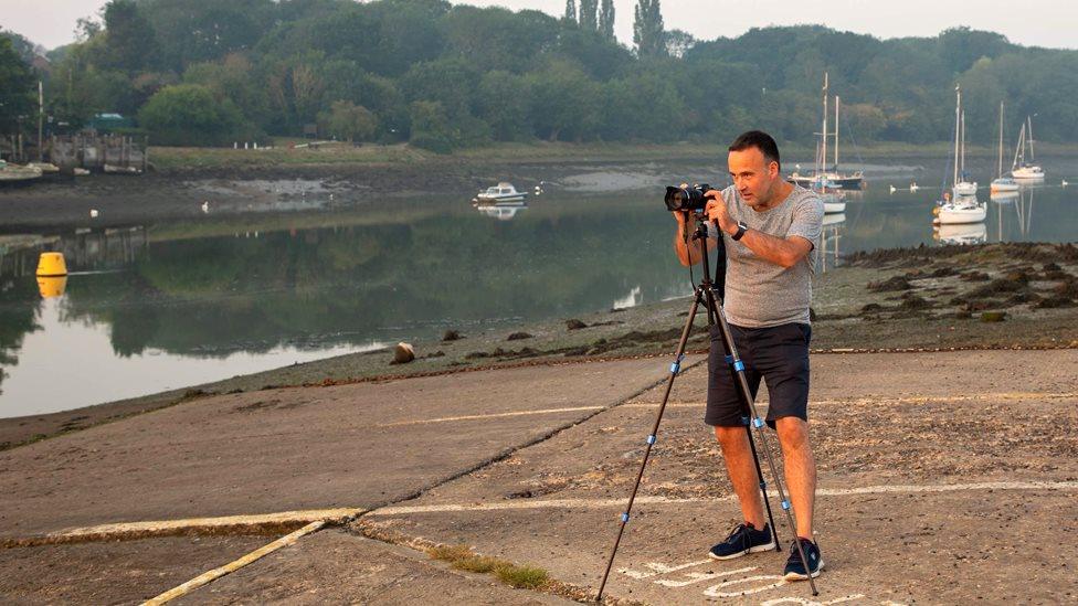 Adam Bennett photographing the sunrise in South Woodham Ferrers