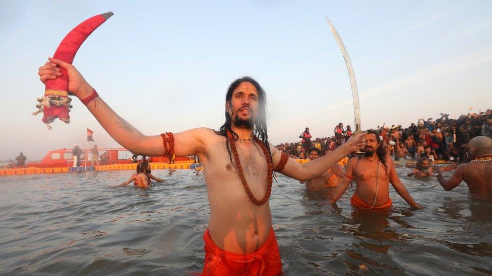 Hindu holy men taking a dip at the Sangam