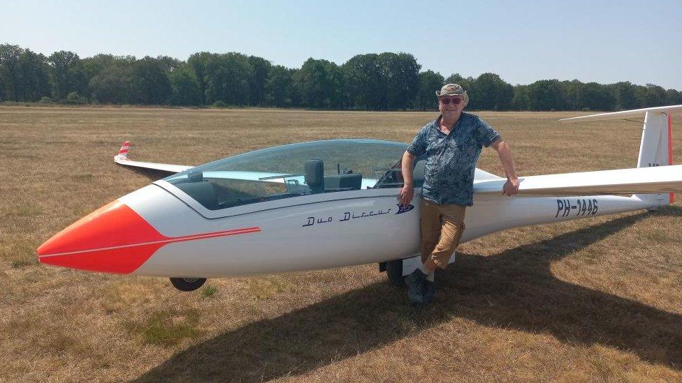 Bert Janssen pictured in front of a glider