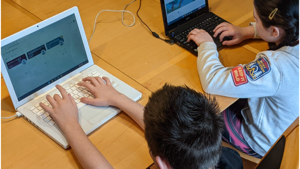 Children working on laptops