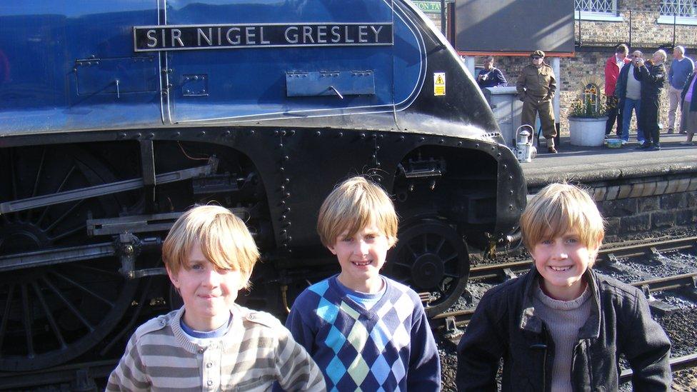 The Waddington brothers as children with the locomotive Sir Nigel Gresley