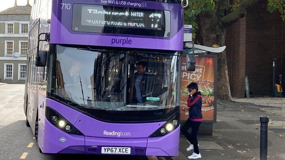 Passengers getting on bus in Reading