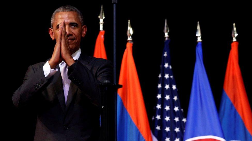 US President Barack Obama holds his hands together and bows at the end of his address at the Lao National Cultural Hall, on the sidelines of the ASEAN Summit, in Vientiane, Laos 6 September 2016.