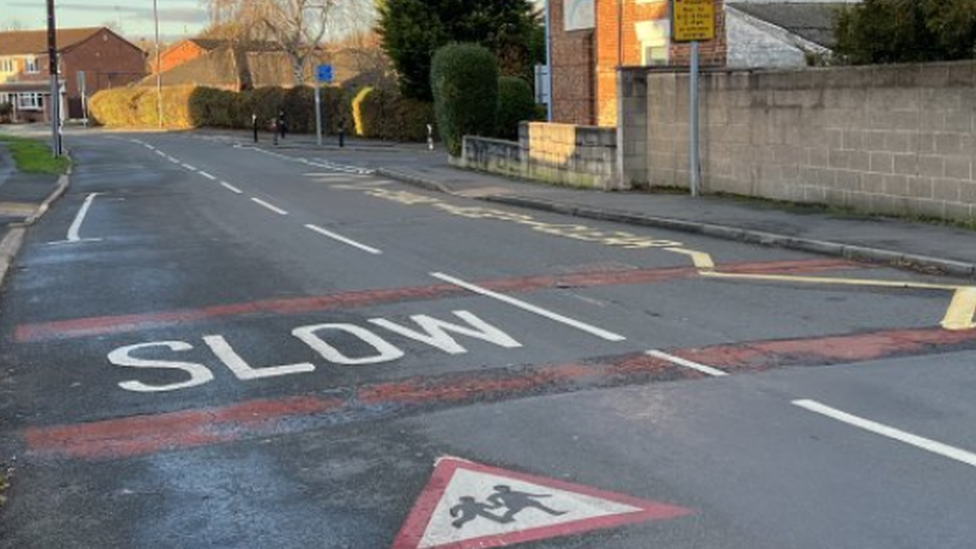 Slow road markings outside school