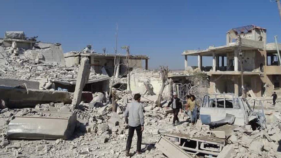 Syria Civil Defence rescue workers at scene of reported air strike in village of Haas, Syria (26 October 2016)
