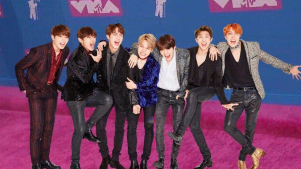 BTS photoshopped onto the pink carpet