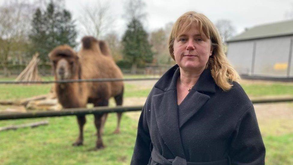 Claudia Roberts and a camel in the background