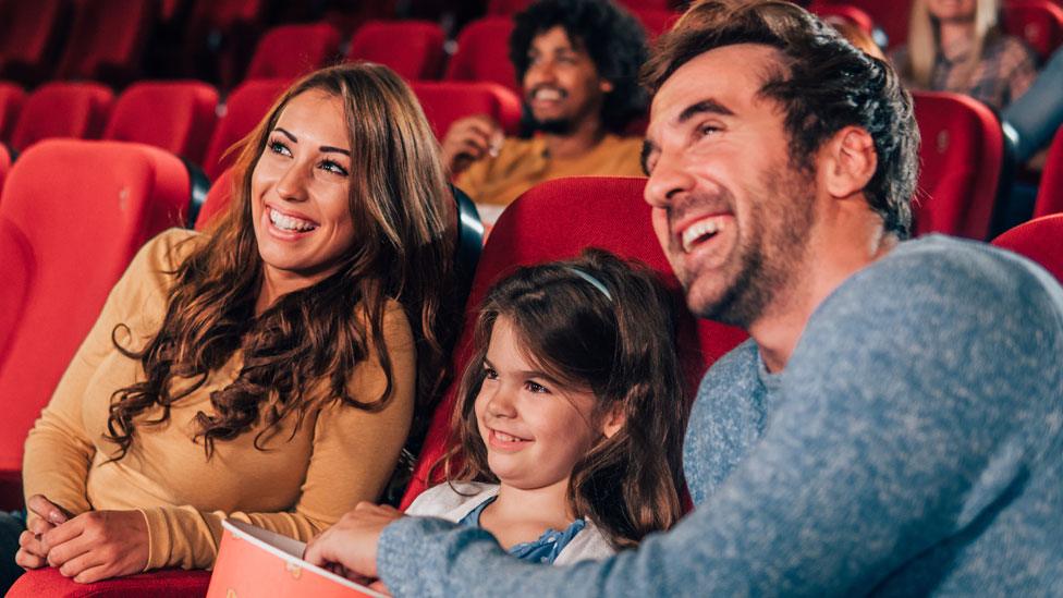 Family watching a movie