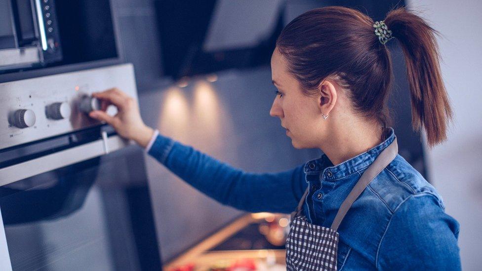 Woman using cooker