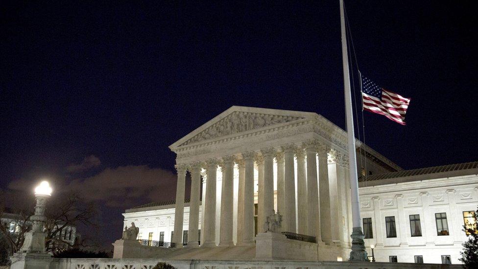 The flag outside the US Supreme Court is lowered in honour of Justice Scalia