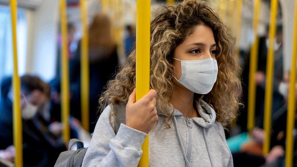 Passengers on a train in face masks