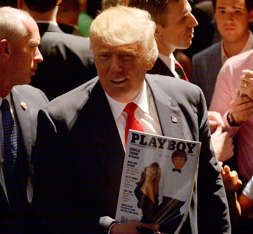 Donald Trump carrying a Playboy magazine with himself on the cover at a campaign event in 2016