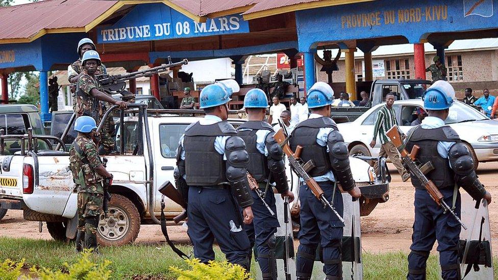 UN soldiers stand guard on October 23, 2014 in Beni.