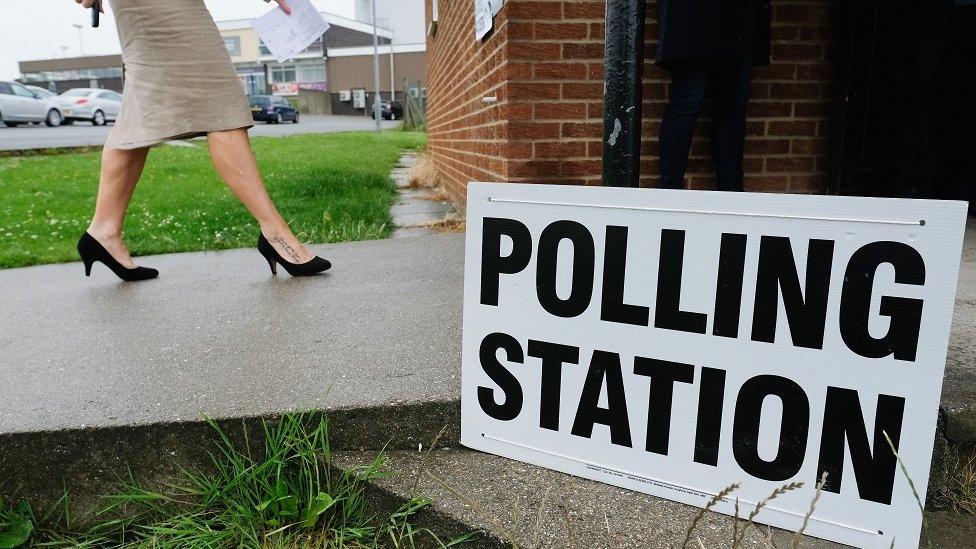 A woman walks into a polling station on June 8, 2017 in Saltburn-by-the-Sea