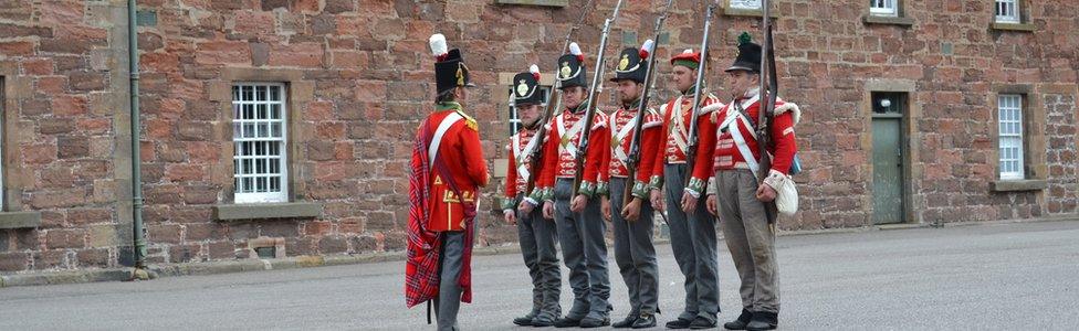 Re-enactors in uniforms worn by Scottish soldiers in the Crimean War