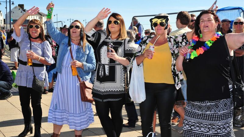 Women at the Elvis festival in Porthcawl with ELvis fancy dress on