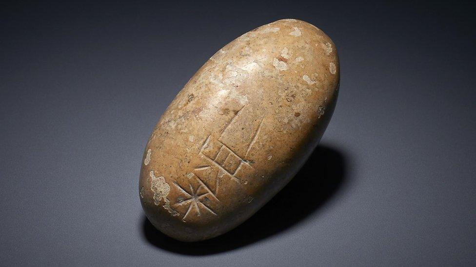 Pebble with inscription