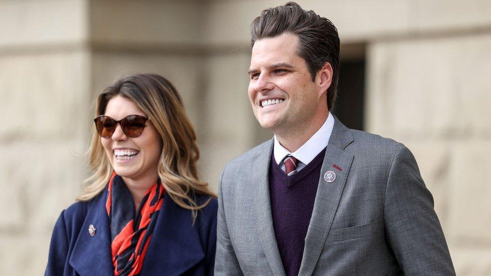 Representative Matt Gaetz walks with his fiancée Ginger Luckey