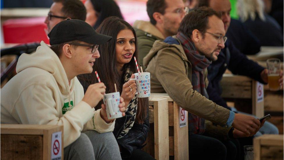 People enjoying Manchester Christmas Markets