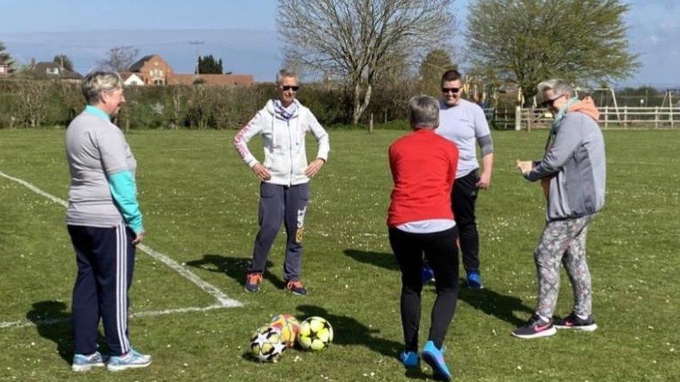 Women around a football