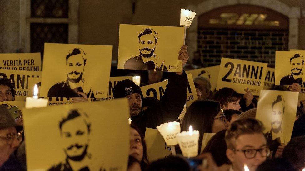 People take part in a torchlight procession organized by Amnesty International to commemorate the second anniversary of the death of Giulio Regeni on January 25, 2018 in Rome, Italy