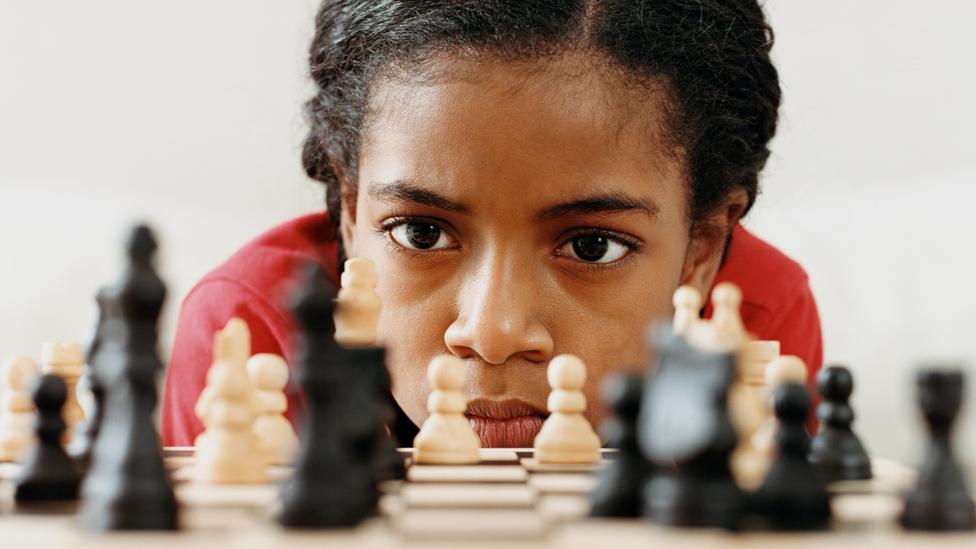 Girl playing chess