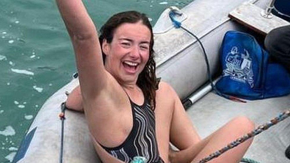 Evie Amena on a boat having swam the English Channel