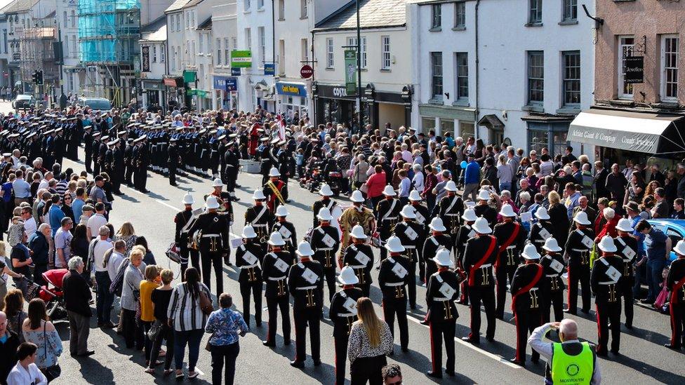 Crowds gather to watch the parade