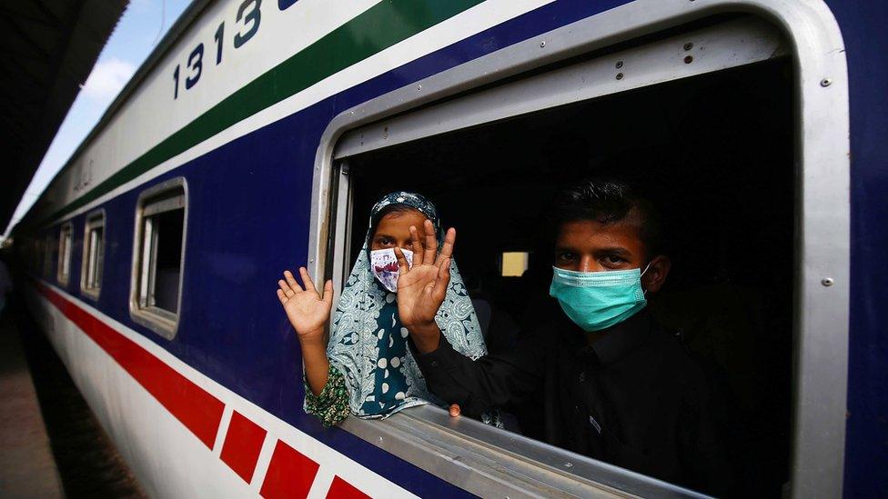 Masked passengers on a Pakistan Railways train, Karachi (10 May)