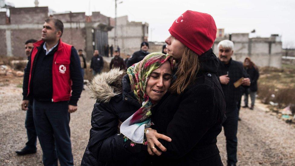 Kilis resident Fevziye Demir cries after a rocket fired from Syria hit her house on 23 January 2018