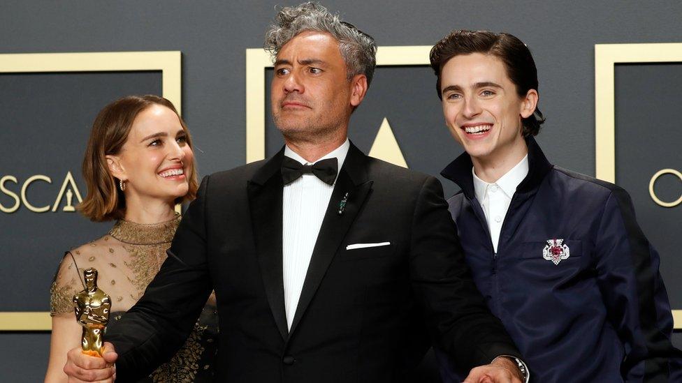 Timothee Chalamet (right) and Natalie Portman (left) with Taika Waititi