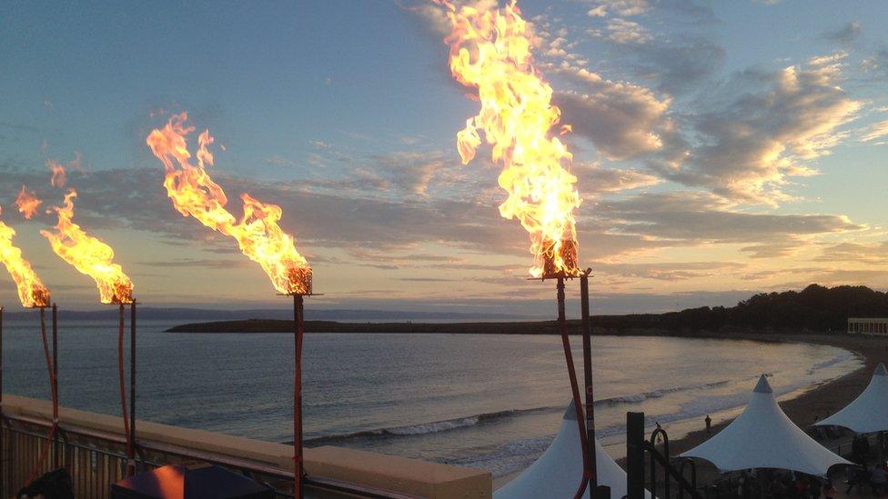 Gas lanterns burning bright in Barry Island as part of an acrobatic fire show. They were photographed against the evening sky by Murshed Khan, of Cardiff