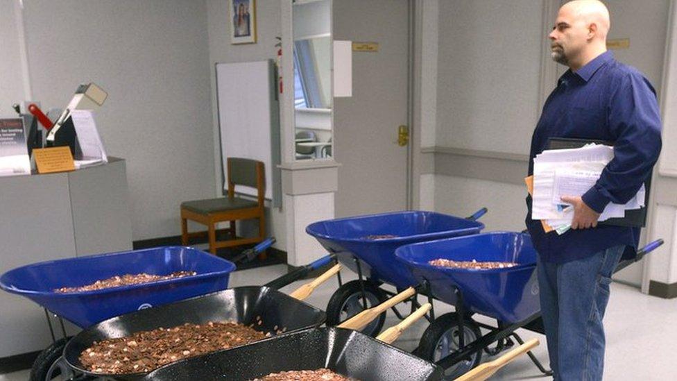 Nick Stafford with his five wheelbarrows of coins (11 January 2017)