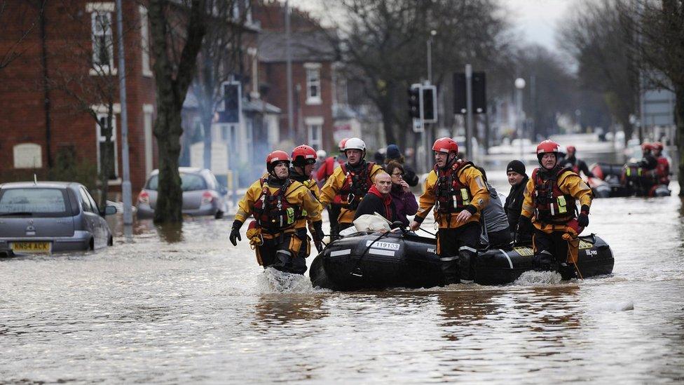 Fire and Rescue teams rescuing people out of flooded homes in Carlisle