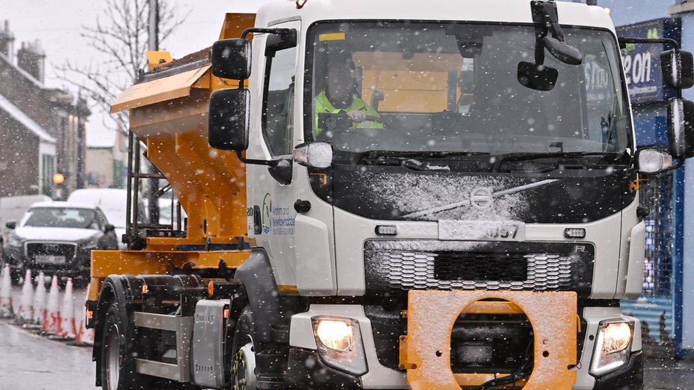 A lorry gritted the streets in Crumlin ,County Antrim, after heavy snow on Thursday