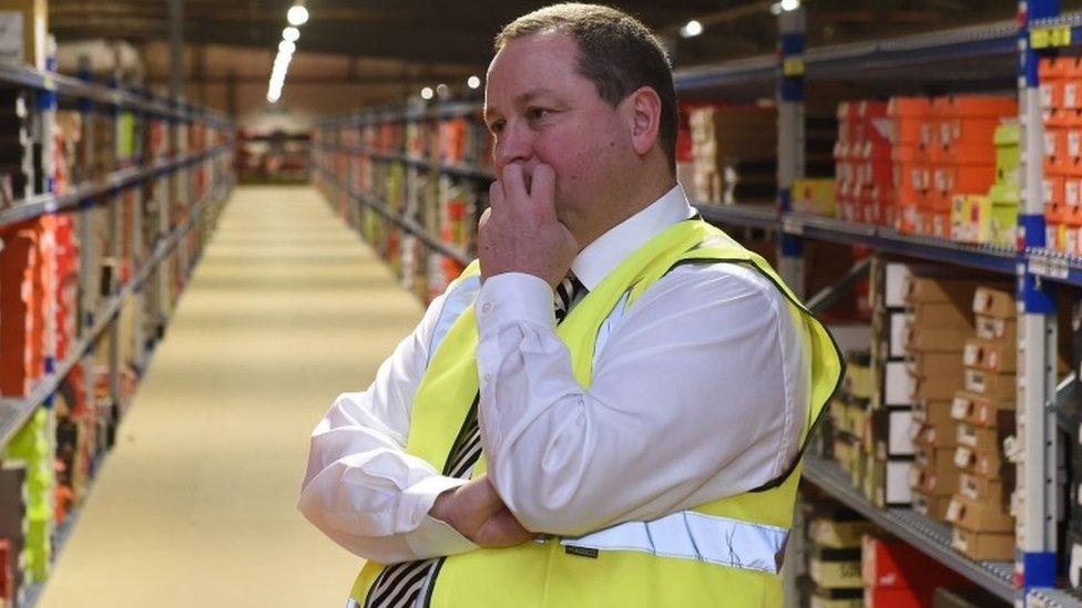 Sports Directs founder Mike Ashley looking pensive at his company's Shirebrook warehouse