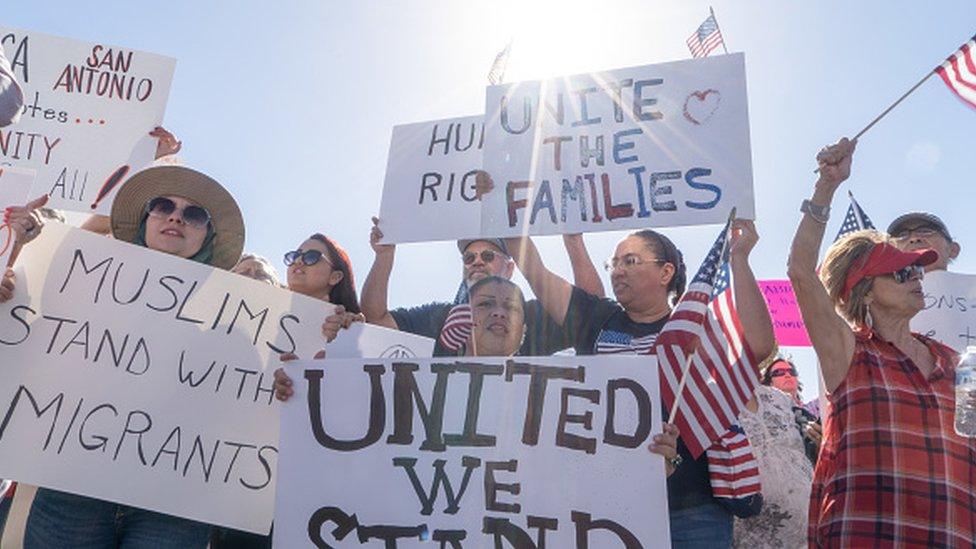 Activists shout chants during the "End Family Detention" event held in Tornillo, Texas