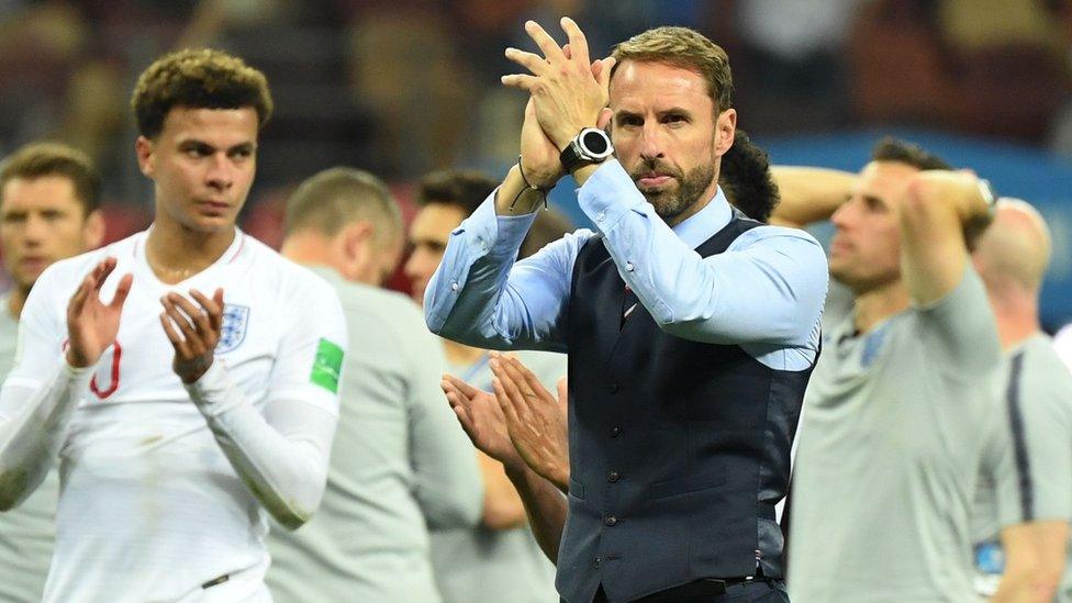 Gareth Southgate applauding fans.