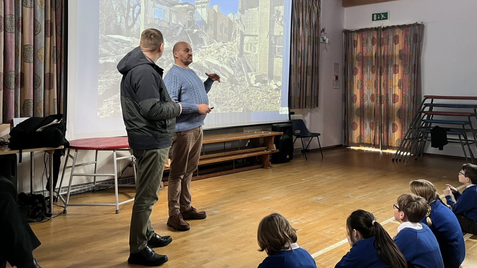 Pupils listening to the talk by charity worker Alex Stroie