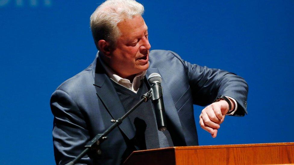 Former Vice President Al Gore checks his watch to check the time until election day as he speaks during a campaign rally for Democratic presidential candidate Hillary Clinton on Monday, 7 November 2016,