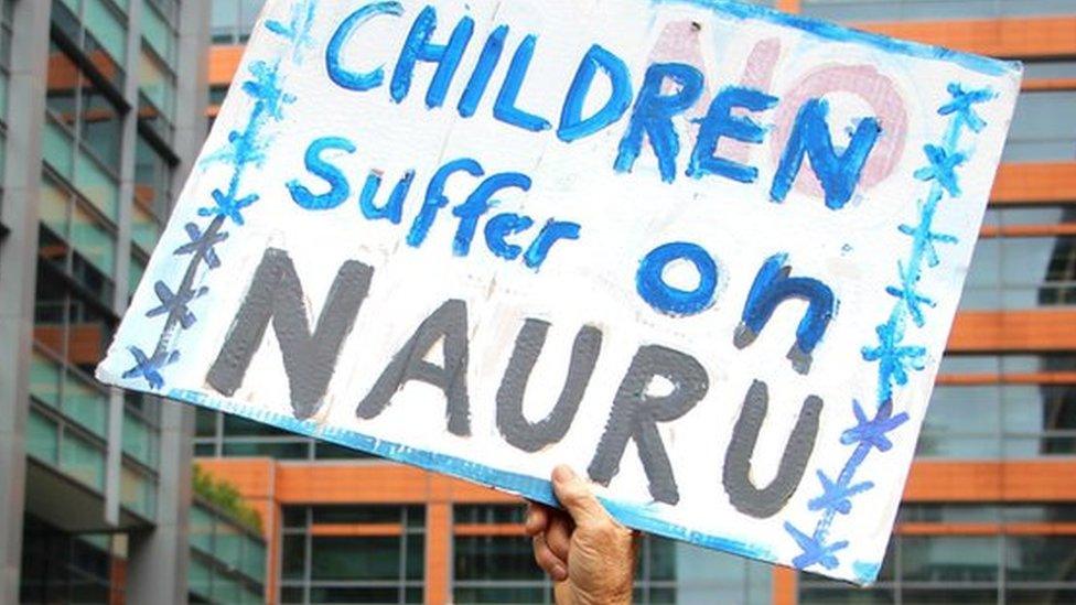 Activists hold placards and chant slogans as they protest outside the offices of the Australian Immigration Department in Sydney, Australia, in this file picture taken February 4, 2016.