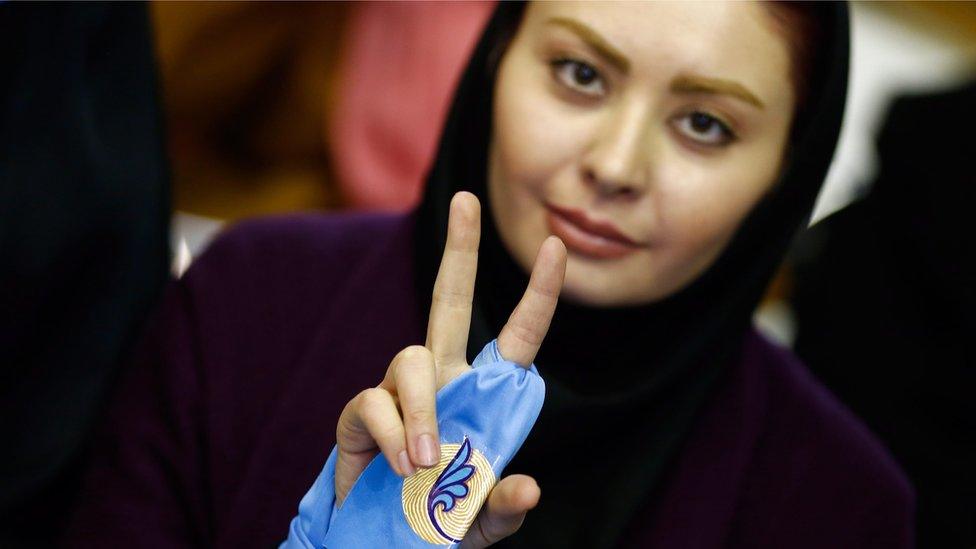 An Iranian supporter of reformist group flashes victory sign during the first reformists election campaign in Tehran, Iran, 18 February 2016