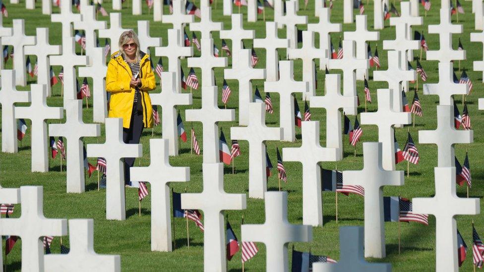 visitor-walks-through-Normandy-American-Cemetery.