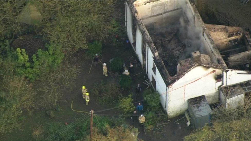 An aerial view of the house shows the devastation caused by the fire