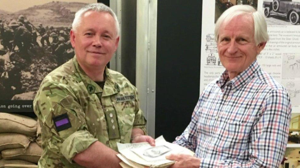 Lily's son, Dr Keith Beattie handing the letters over to Padre Andrew Totten