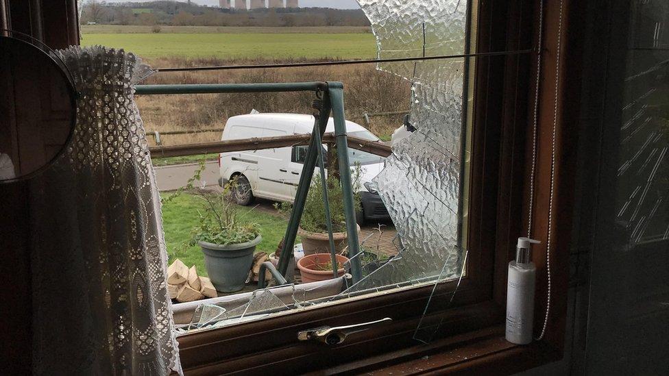 Smashed bathroom window in chalet