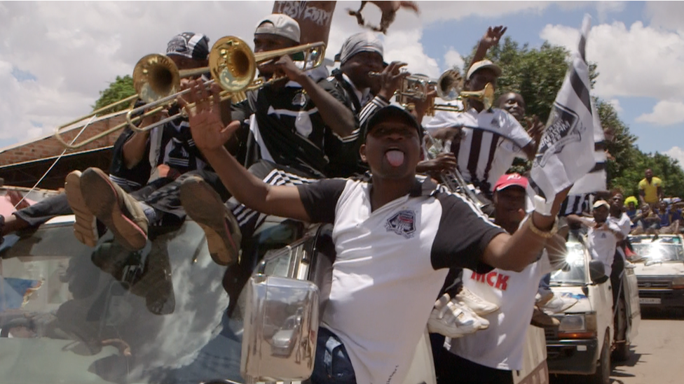 Brass band on a top of a car