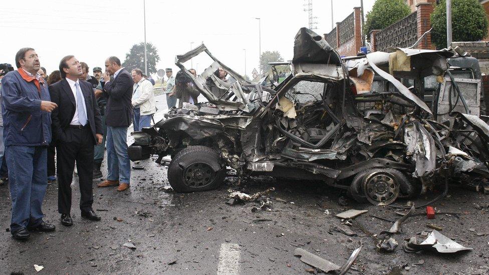 Spanish officials visit the scene of a bomb attack outside a Civil Guard barracks in the Basque region in August 2007